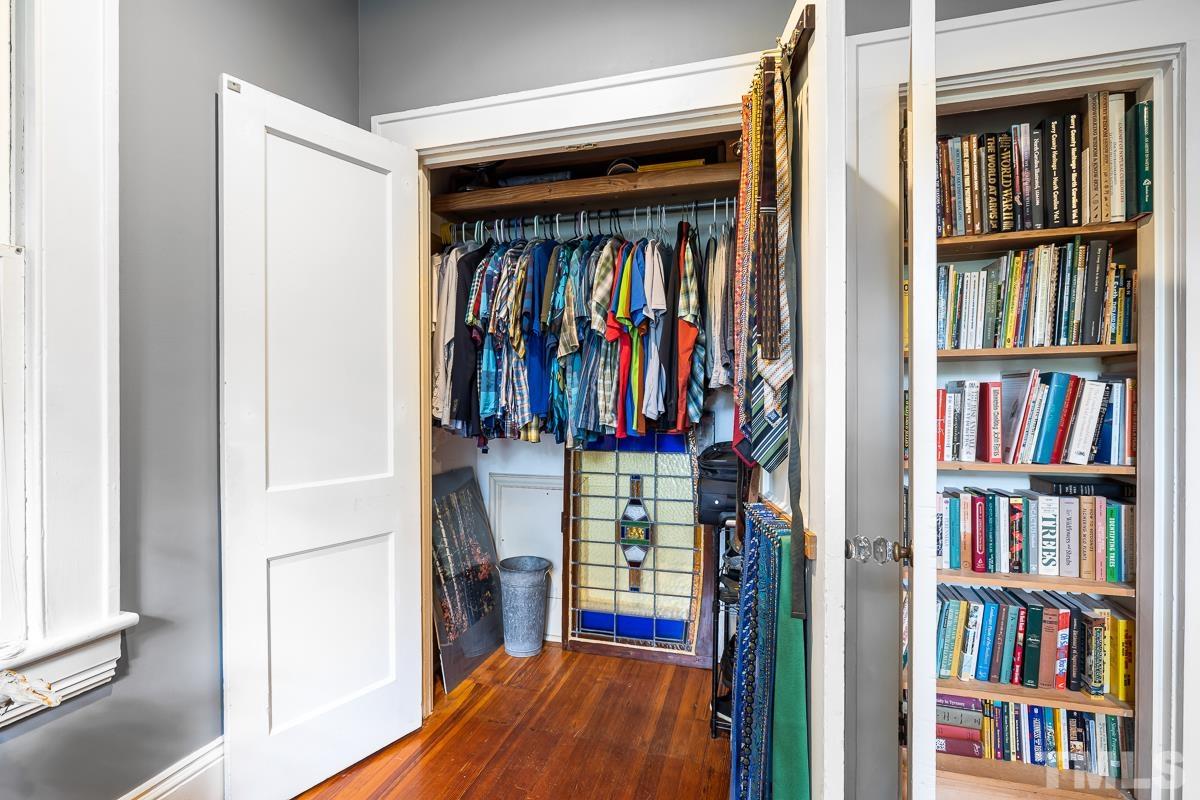 611 North Boundary Street Raleigh, NC 27604 - Photo 18 of 35 a view of walk in closet with clothes and shoes