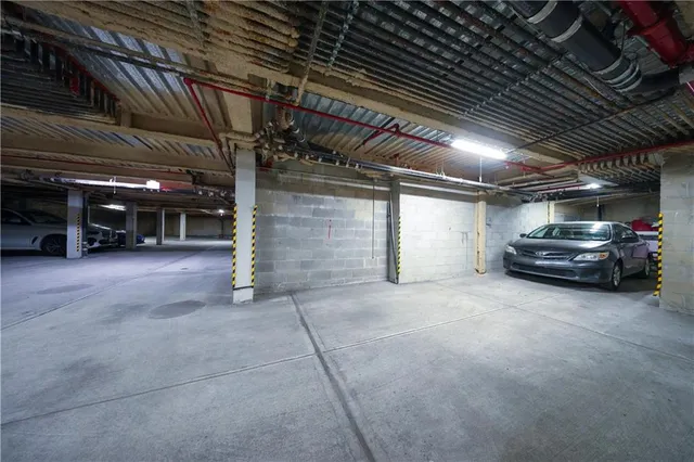 a view of empty room with wooden ceiling