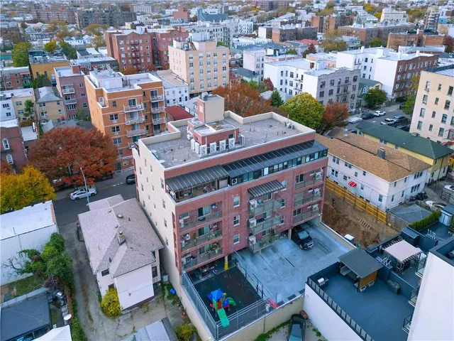 an aerial view of a house with a swimming pool