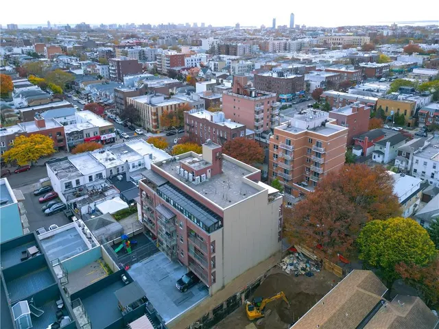 an aerial view of a city with lots of residential buildings