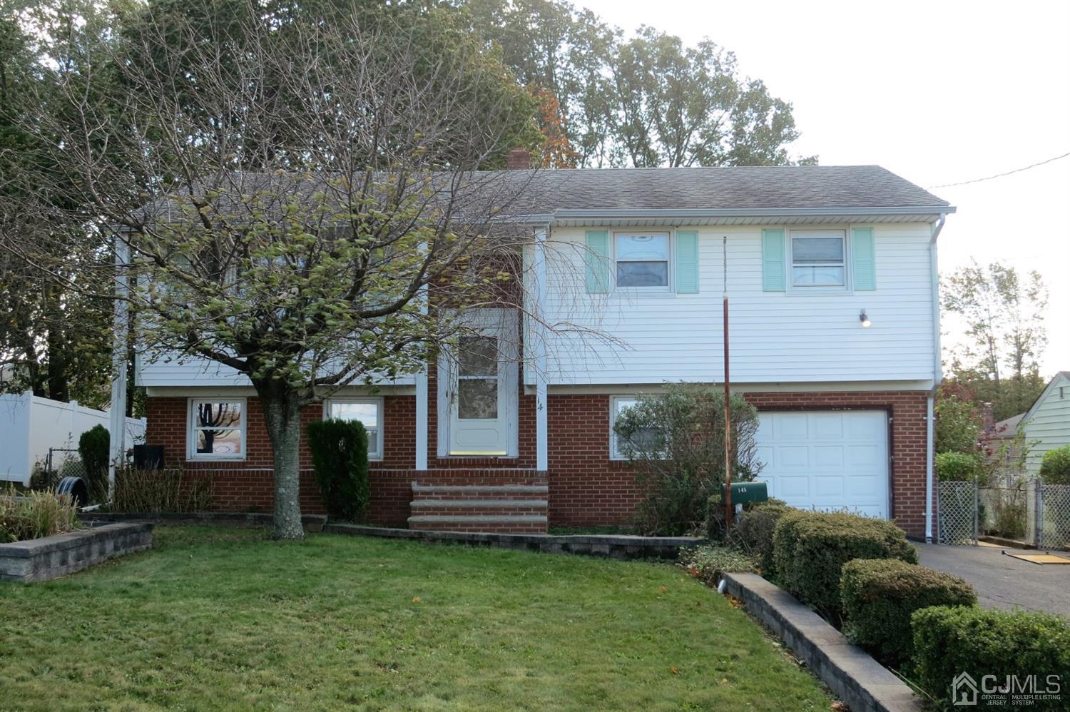 145 Lafayette Road Fords, NJ 08863 - Photo 1 of 18 a front view of a house with a yard