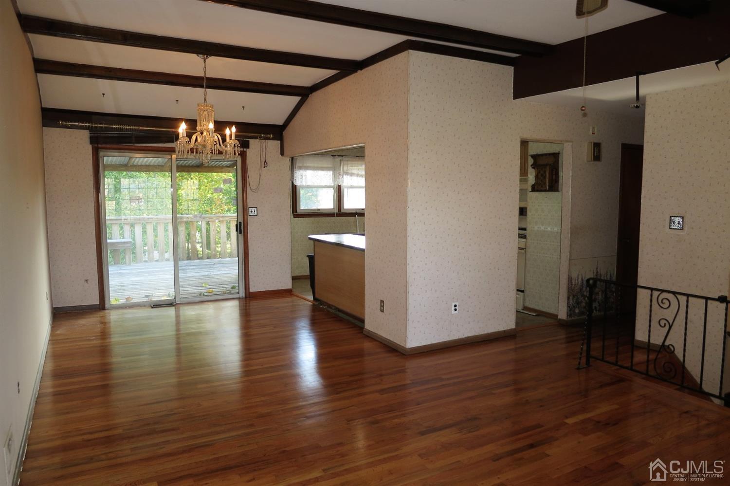 145 Lafayette Road Fords, NJ 08863 - Photo 2 of 18 a view of an empty room with wooden floor and a window