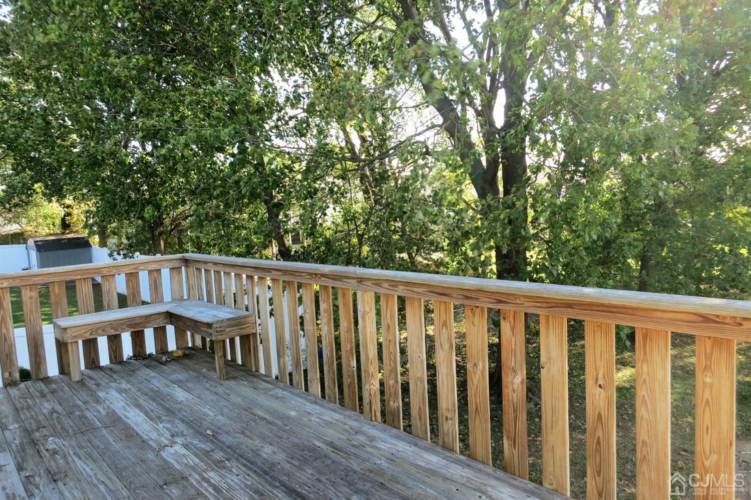 145 Lafayette Road Fords, NJ 08863 - Photo 12 of 18 a balcony with wooden floor and fence