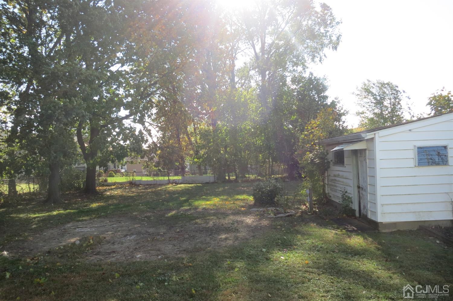 145 Lafayette Road Fords, NJ 08863 - Photo 16 of 18 a backyard of a house with lots of green space