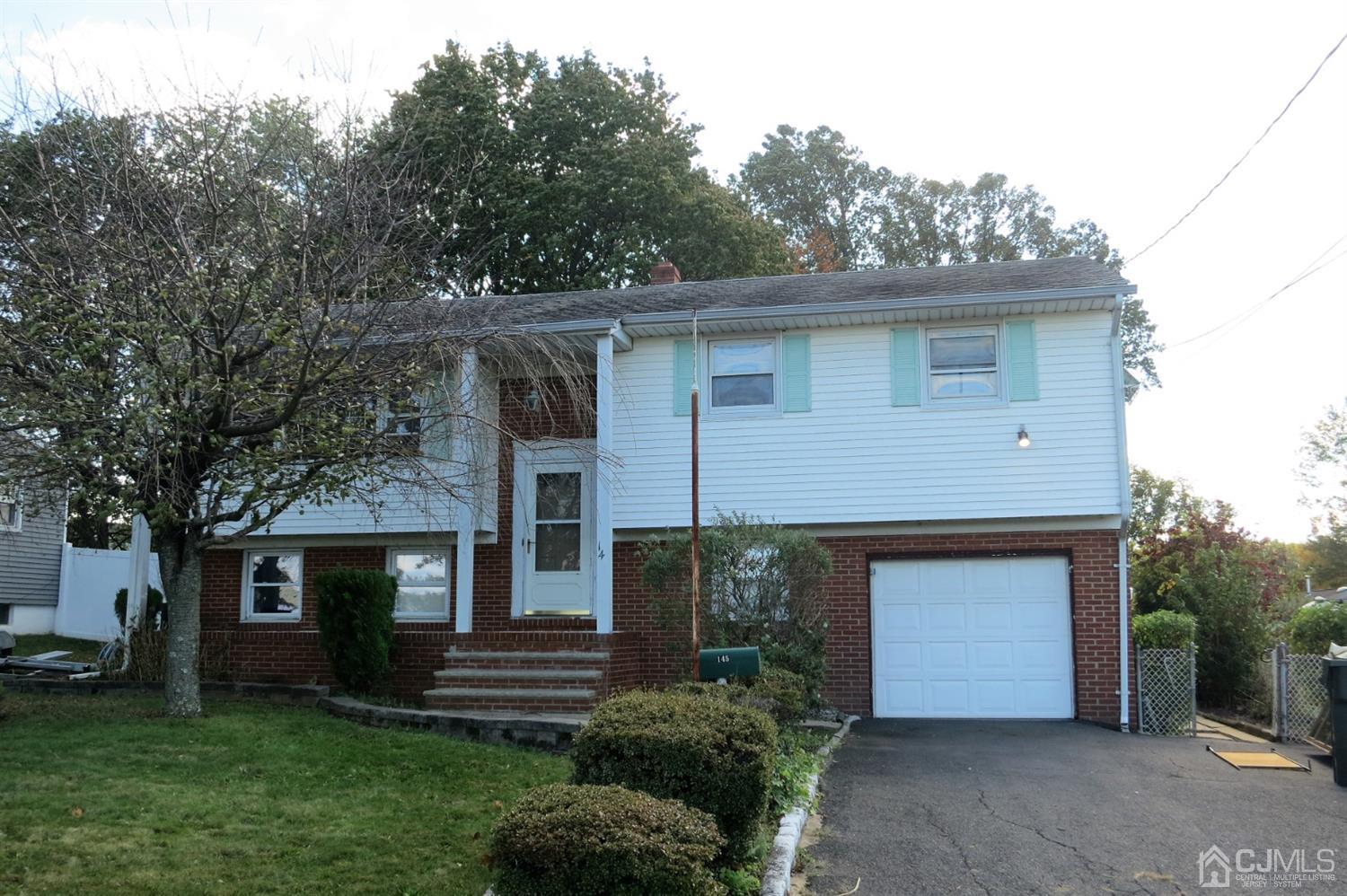145 Lafayette Road Fords, NJ 08863 - Photo 18 of 18 a front view of a house with garden
