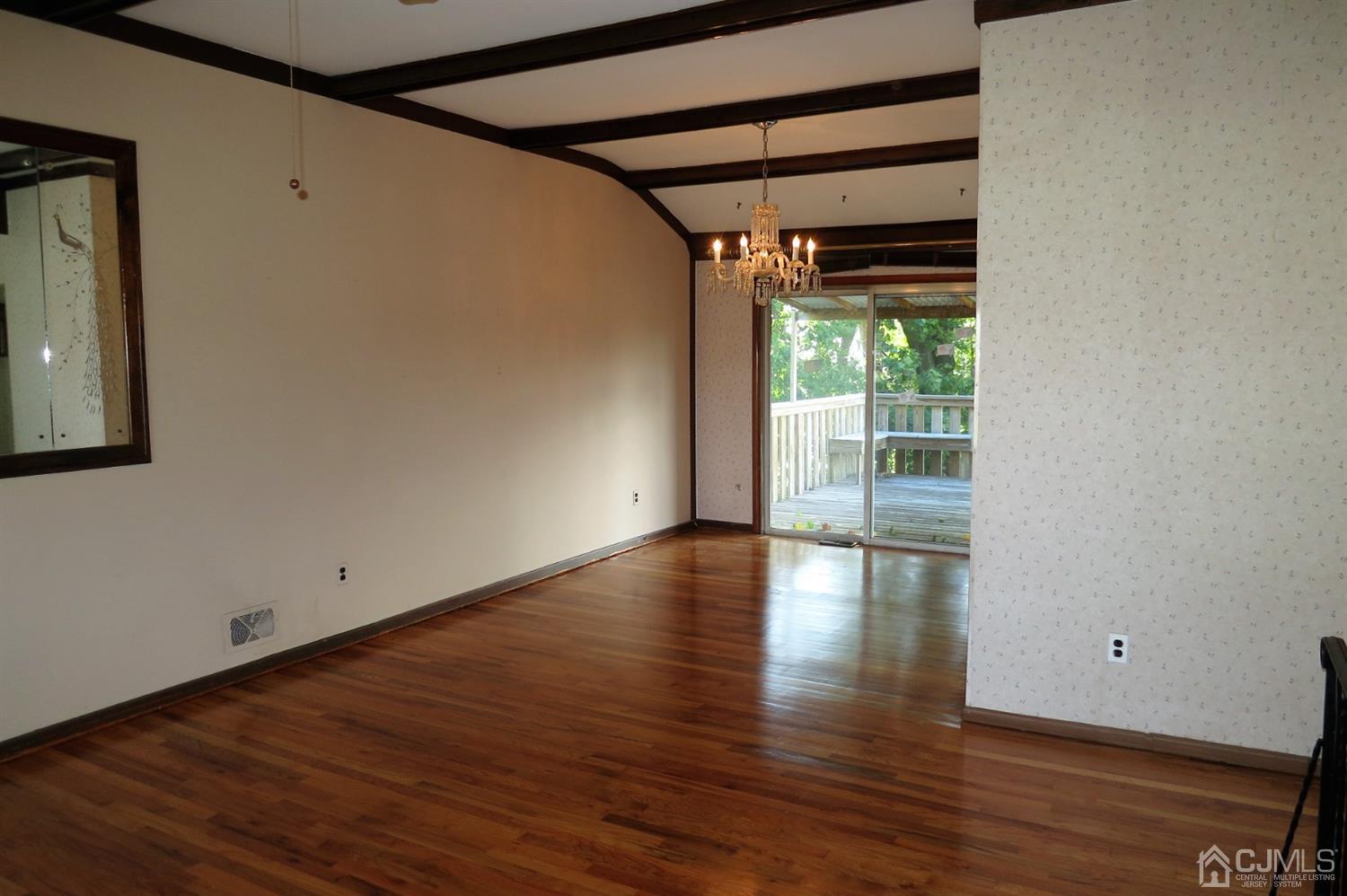 145 Lafayette Road Fords, NJ 08863 - Photo 5 of 18 a view of empty room with wooden floor and fan