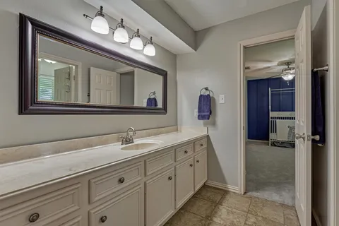 a bathroom with a sink a mirror and a shower