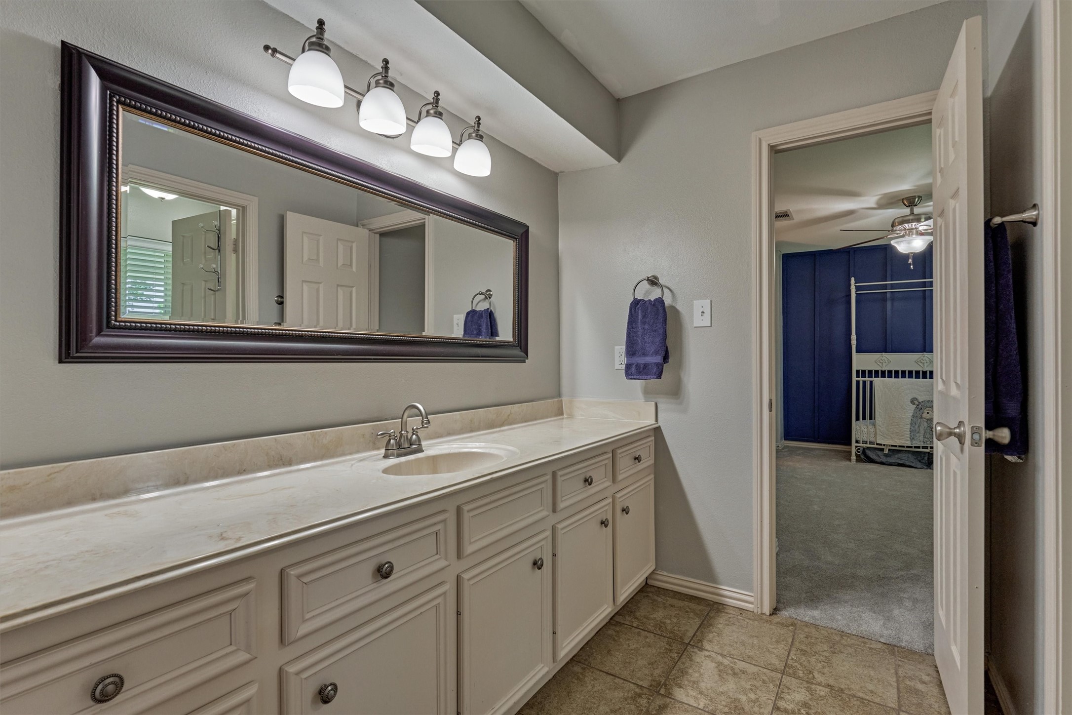 6515 Glenhill Drive Spring, TX 77389 - Photo 24 of 39 a bathroom with a sink a mirror and a shower