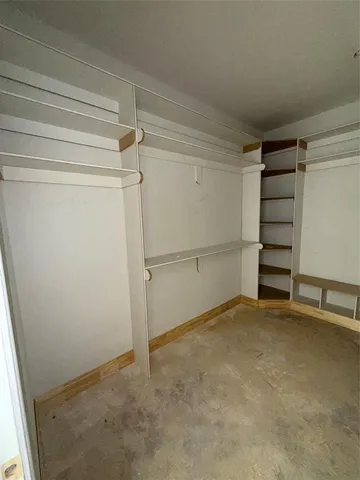 a view of an empty walk in closet