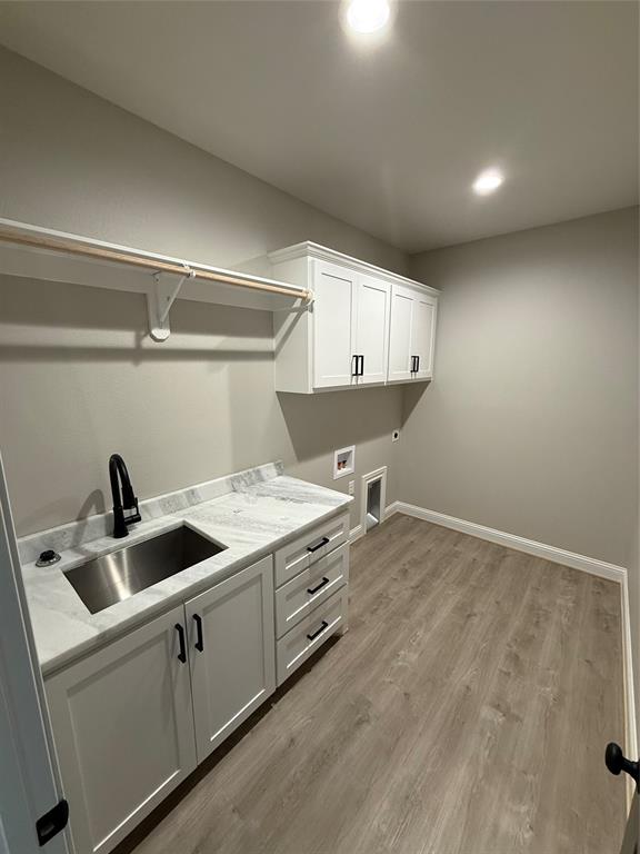 239 Indian Ridge Road Tuscola, TX 79562 - Photo 13 of 26 a kitchen with a stove and a sink