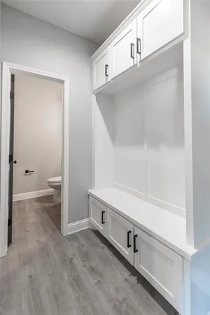 a bathroom with a sink a toilet and mirror