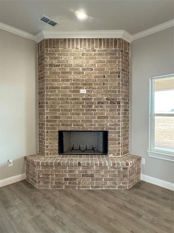 239 Indian Ridge Road Tuscola, TX 79562 - Photo 2 of 26 a view of empty room with wooden floor