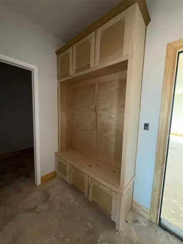 a view of storage and utility room with washer and dryer