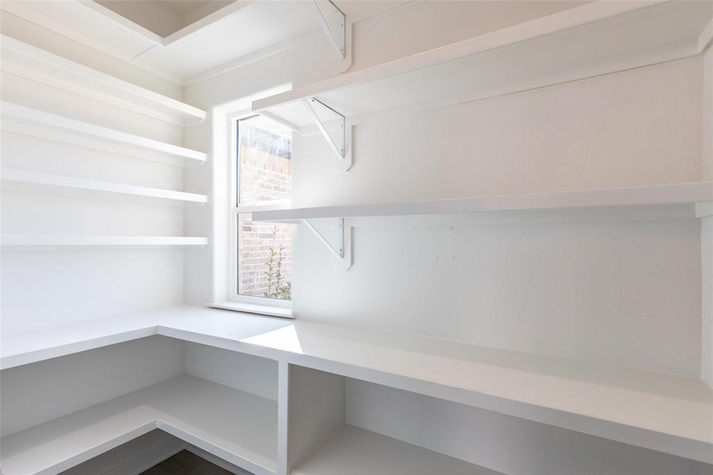239 Indian Ridge Road Tuscola, TX 79562 - Photo 22 of 37 a view of walk in closet with empty racks