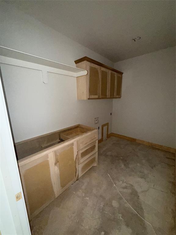 239 Indian Ridge Road Tuscola, TX 79562 - Photo 23 of 24 a view of storage and utility room with washer and dryer