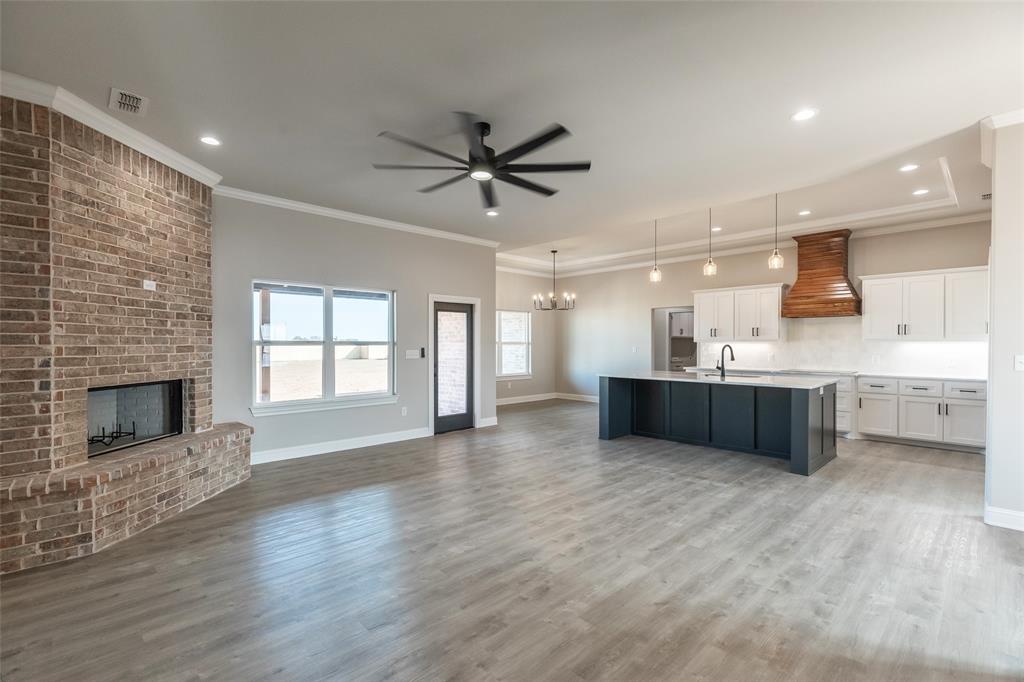 239 Indian Ridge Road Tuscola, TX 79562 - Photo 24 of 37 a large white kitchen with a large window appliances and cabinets