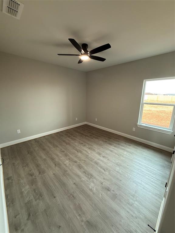 239 Indian Ridge Road Tuscola, TX 79562 - Photo 25 of 26 an empty room with a window and ceiling fan
