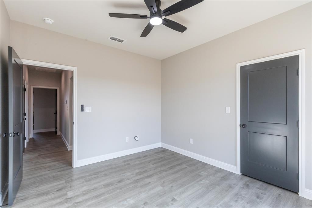 239 Indian Ridge Road Tuscola, TX 79562 - Photo 26 of 37 an empty room with wooden floor closet and windows