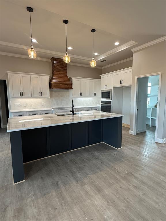 239 Indian Ridge Road Tuscola, TX 79562 - Photo 3 of 26 a open kitchen with stainless steel appliances granite countertop a sink a stove and a refrigerator
