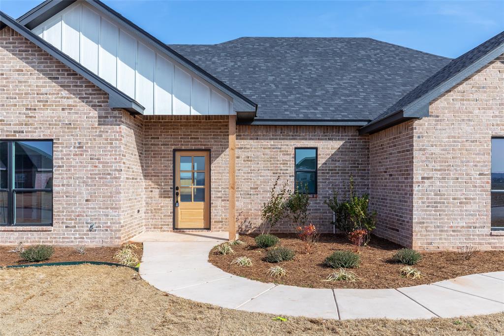 239 Indian Ridge Road Tuscola, TX 79562 - Photo 3 of 37 a front view of a house with garden