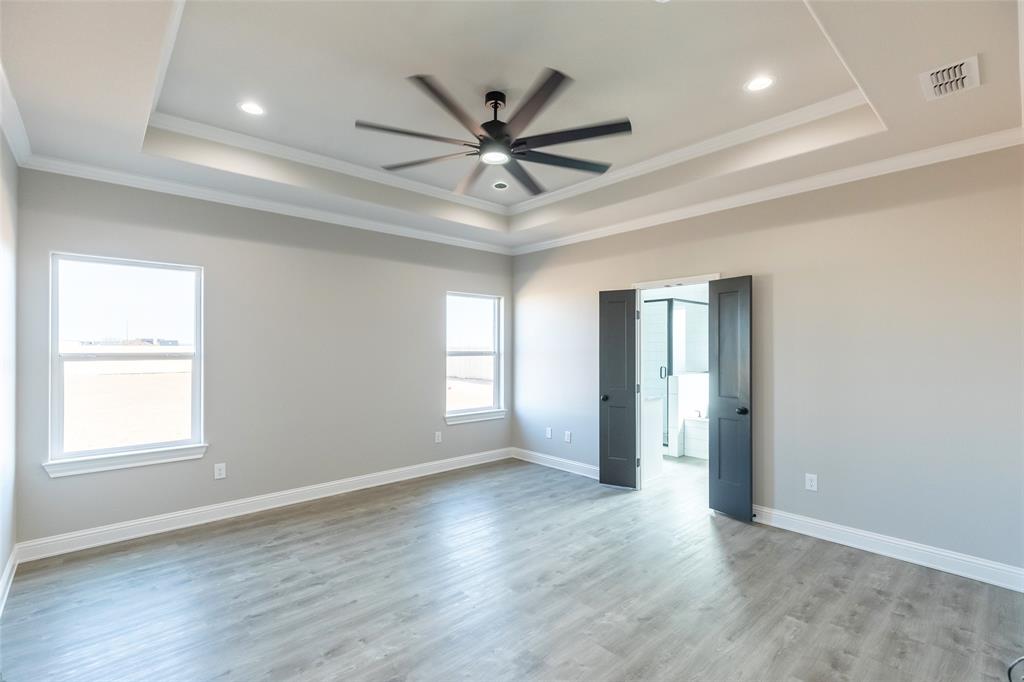 239 Indian Ridge Road Tuscola, TX 79562 - Photo 5 of 37 a view of a livingroom with a ceiling fan and window