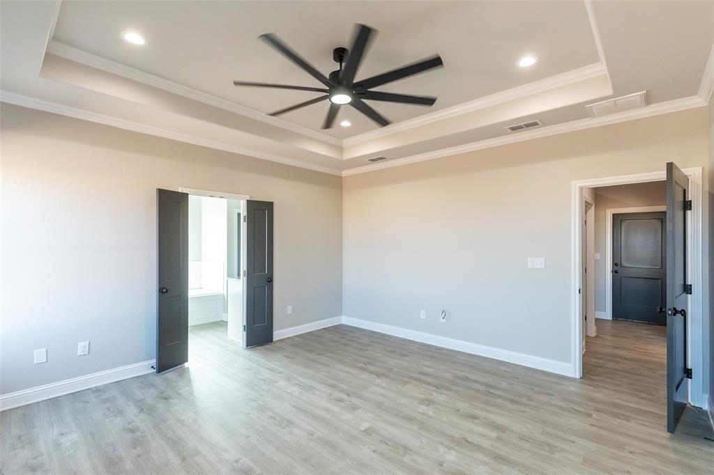 239 Indian Ridge Road Tuscola, TX 79562 - Photo 6 of 37 wooden floor in an empty room with a window
