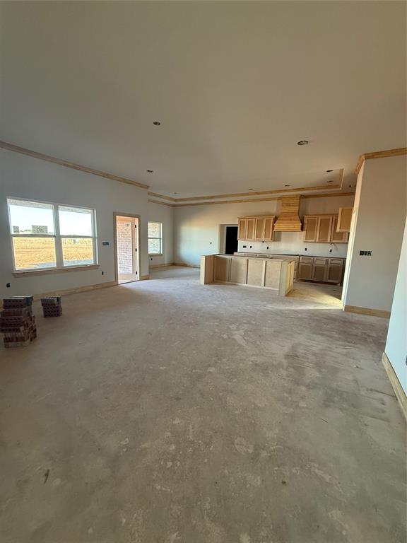 239 Indian Ridge Road Tuscola, TX 79562 - Photo 7 of 24 a big room with chandelier and windows