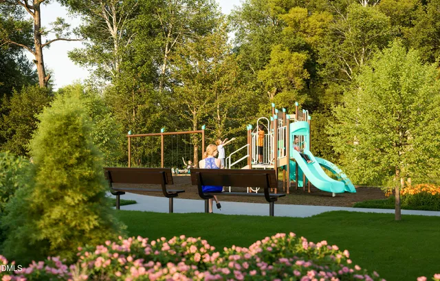 a aerial view of a house with a yard and lake view