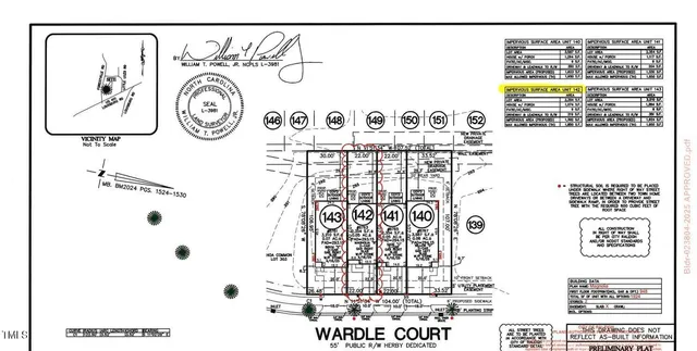 a kitchen with stainless steel appliances granite countertop a sink a stove top oven a refrigerator with white cabinets and wooden floor