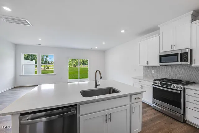 a view of an empty room with glass door
