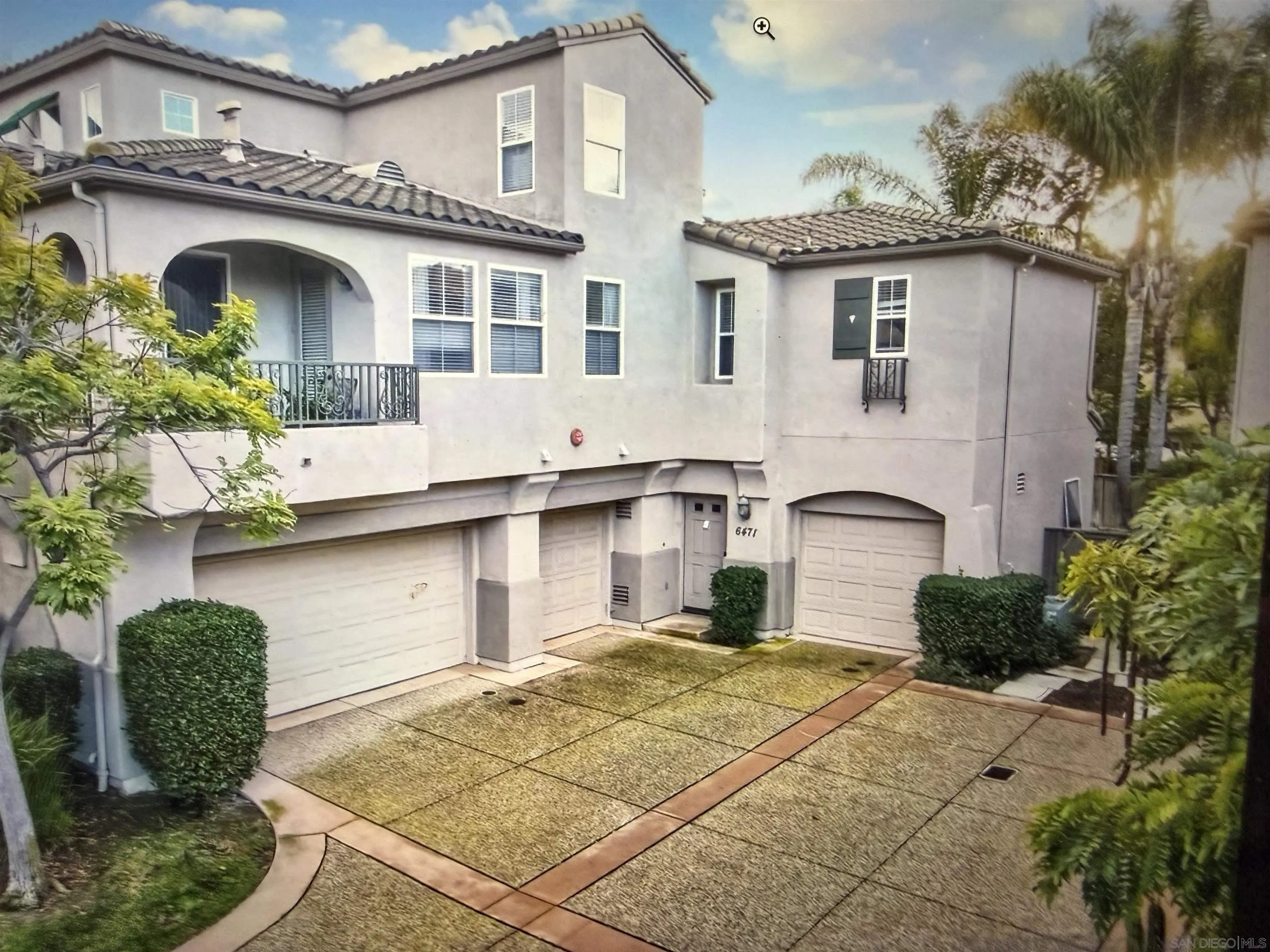 6471 Terraza Portico Carlsbad, CA 92009 - Photo 1 of 19 a front view of a house with garden