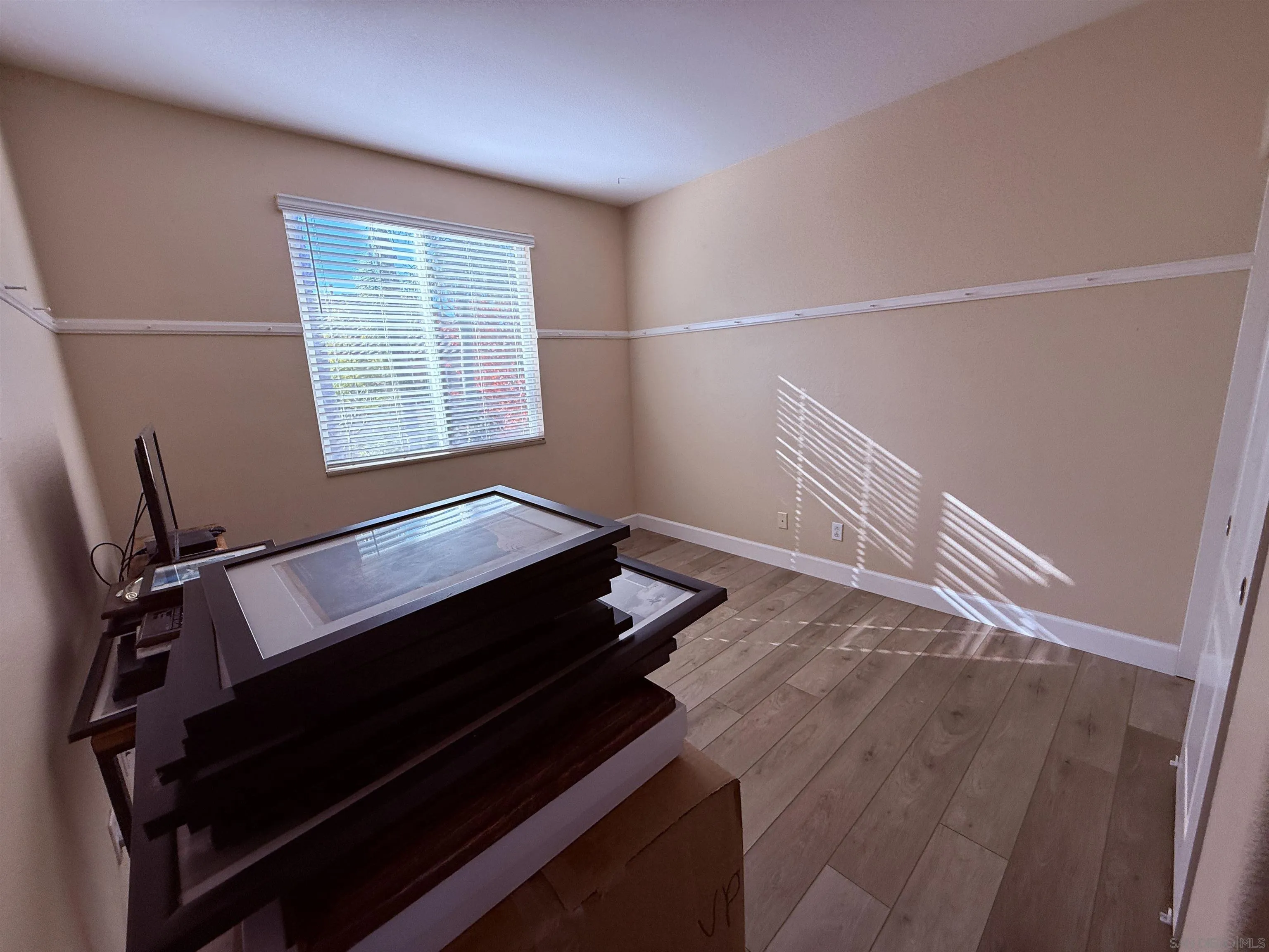 6471 Terraza Portico Carlsbad, CA 92009 - Photo 13 of 19 a view of a room with wooden floor and windows