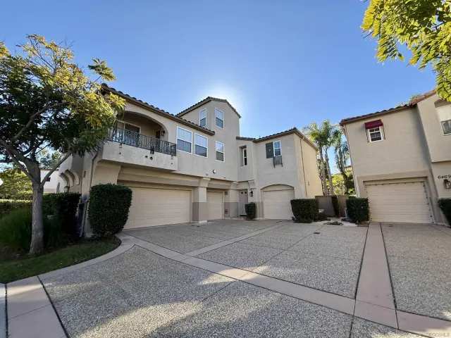 a front view of a house with a garage