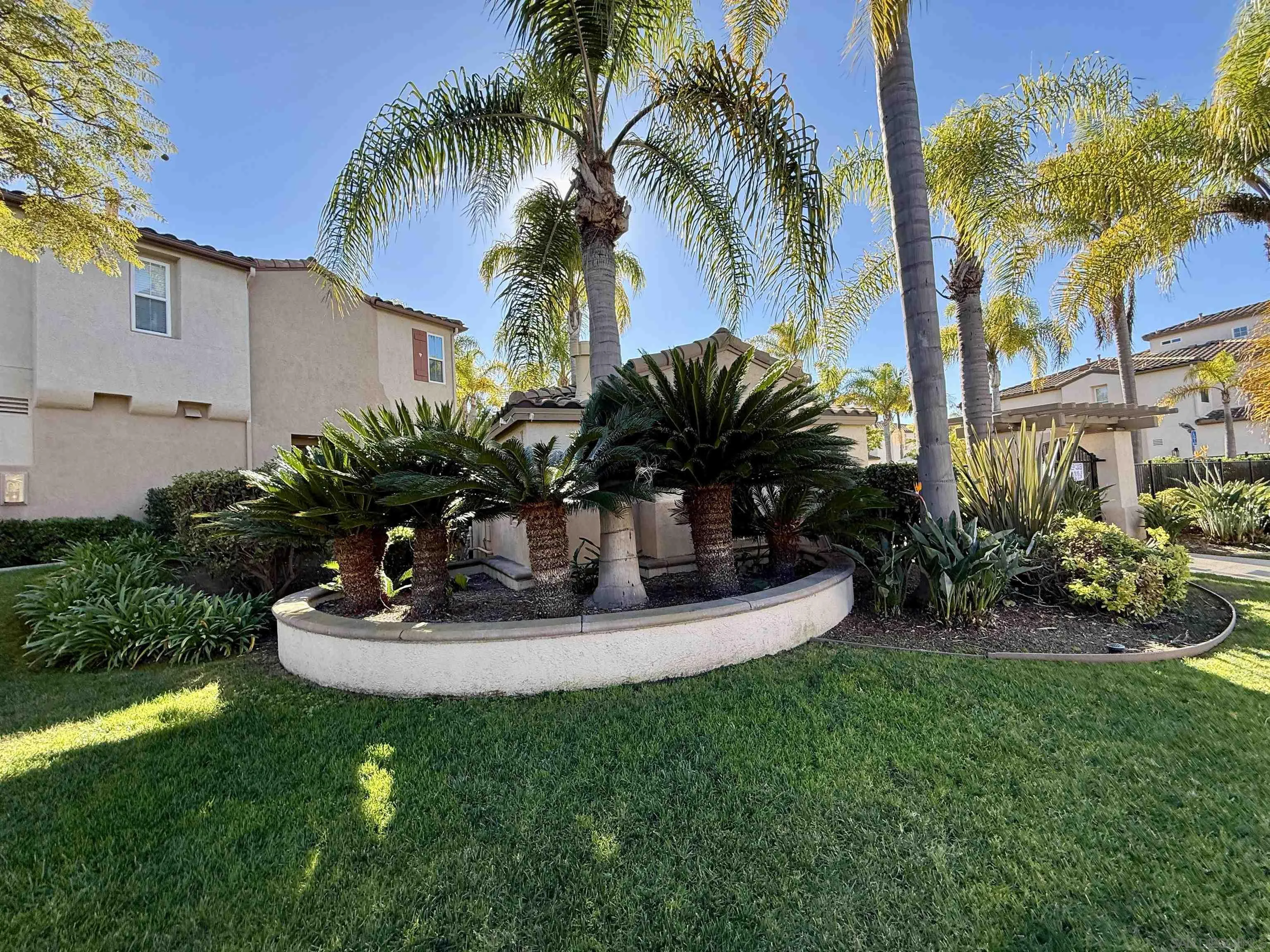 6471 Terraza Portico Carlsbad, CA 92009 - Photo 19 of 19 a view of a house with backyard and sitting area