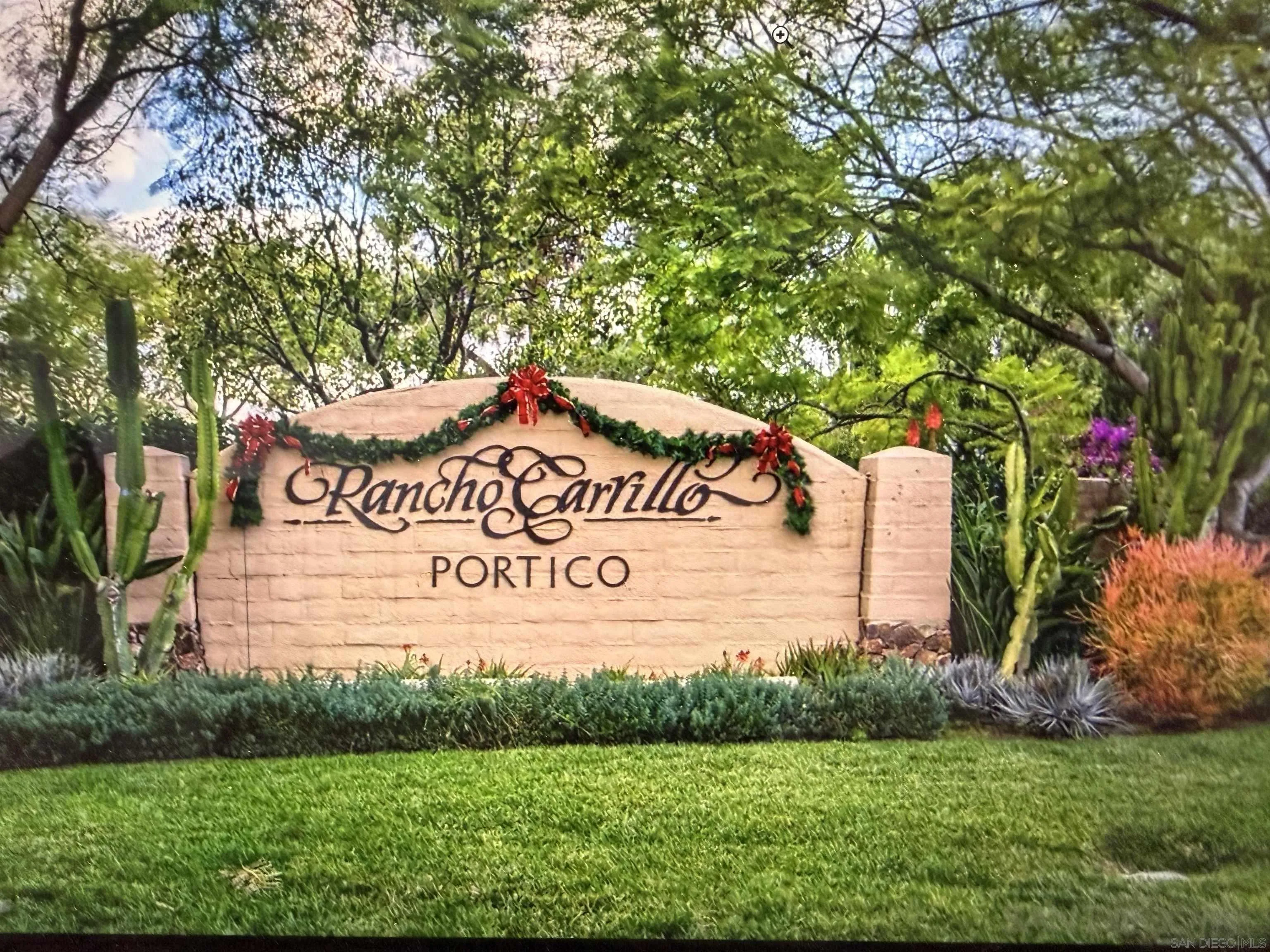 6471 Terraza Portico Carlsbad, CA 92009 - Photo 2 of 19 a sign on the side of a road