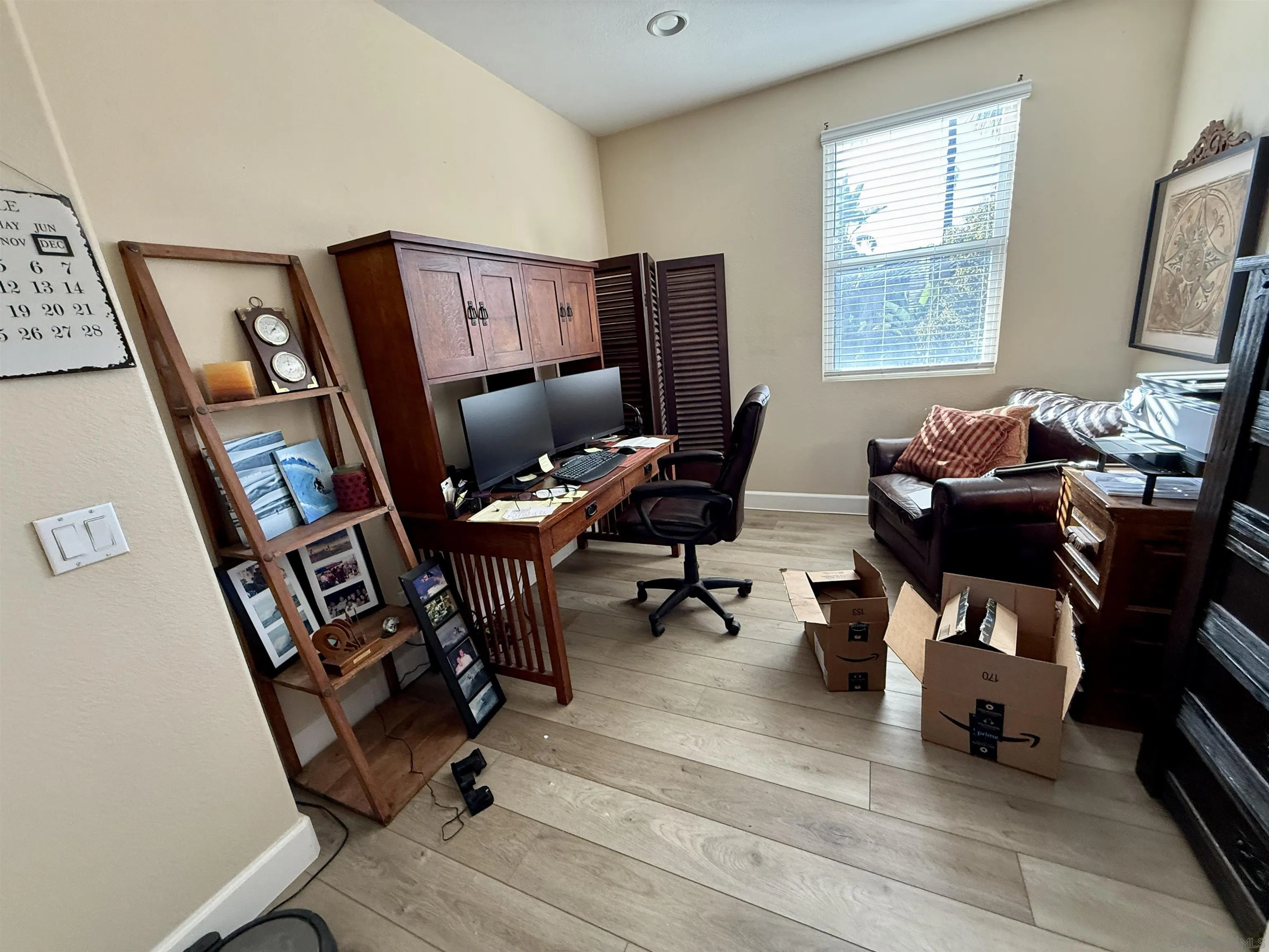 6471 Terraza Portico Carlsbad, CA 92009 - Photo 3 of 19 a view of a workspace with furniture and a window