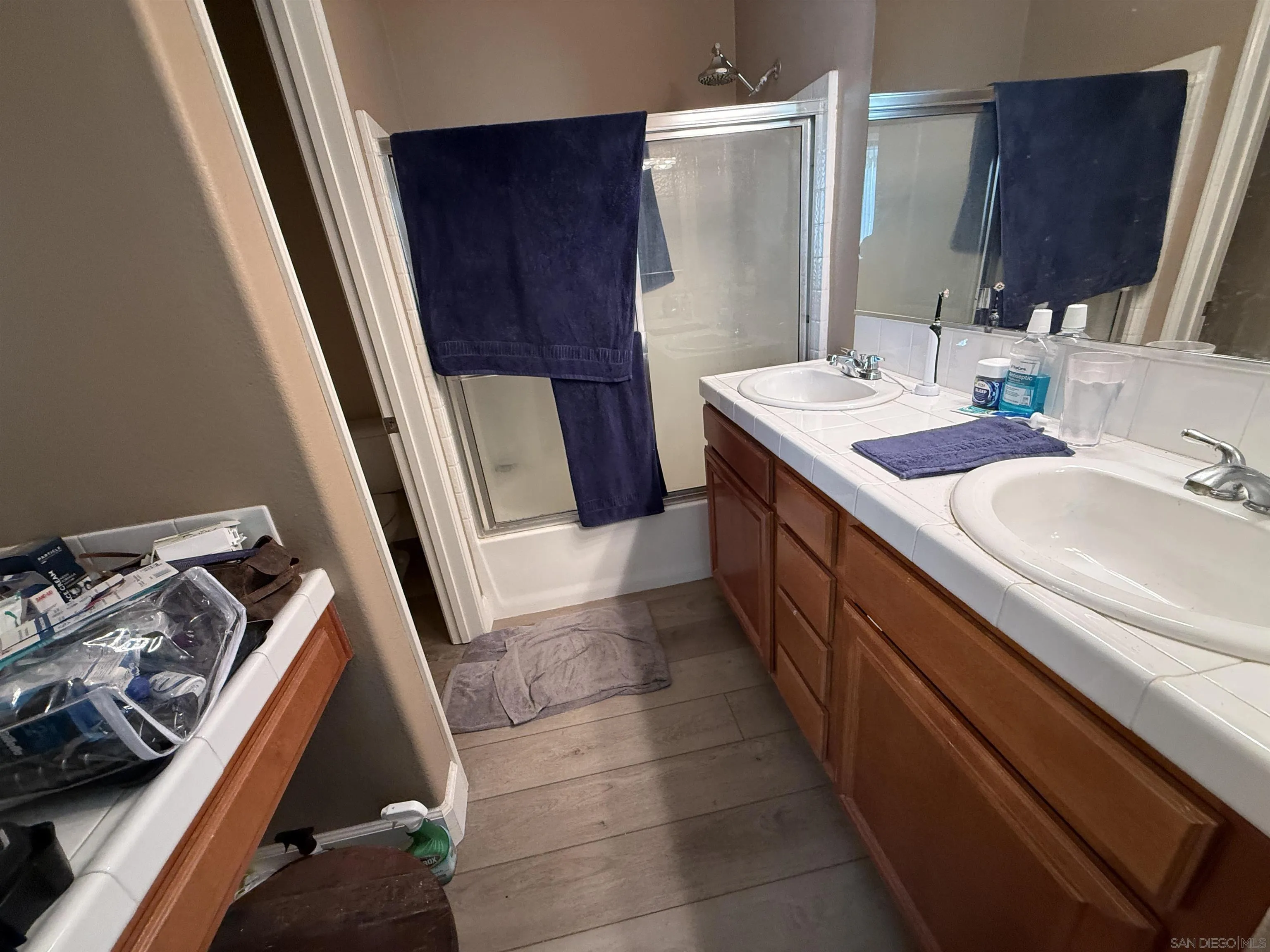 6471 Terraza Portico Carlsbad, CA 92009 - Photo 6 of 19 a bathroom with sink and mirror