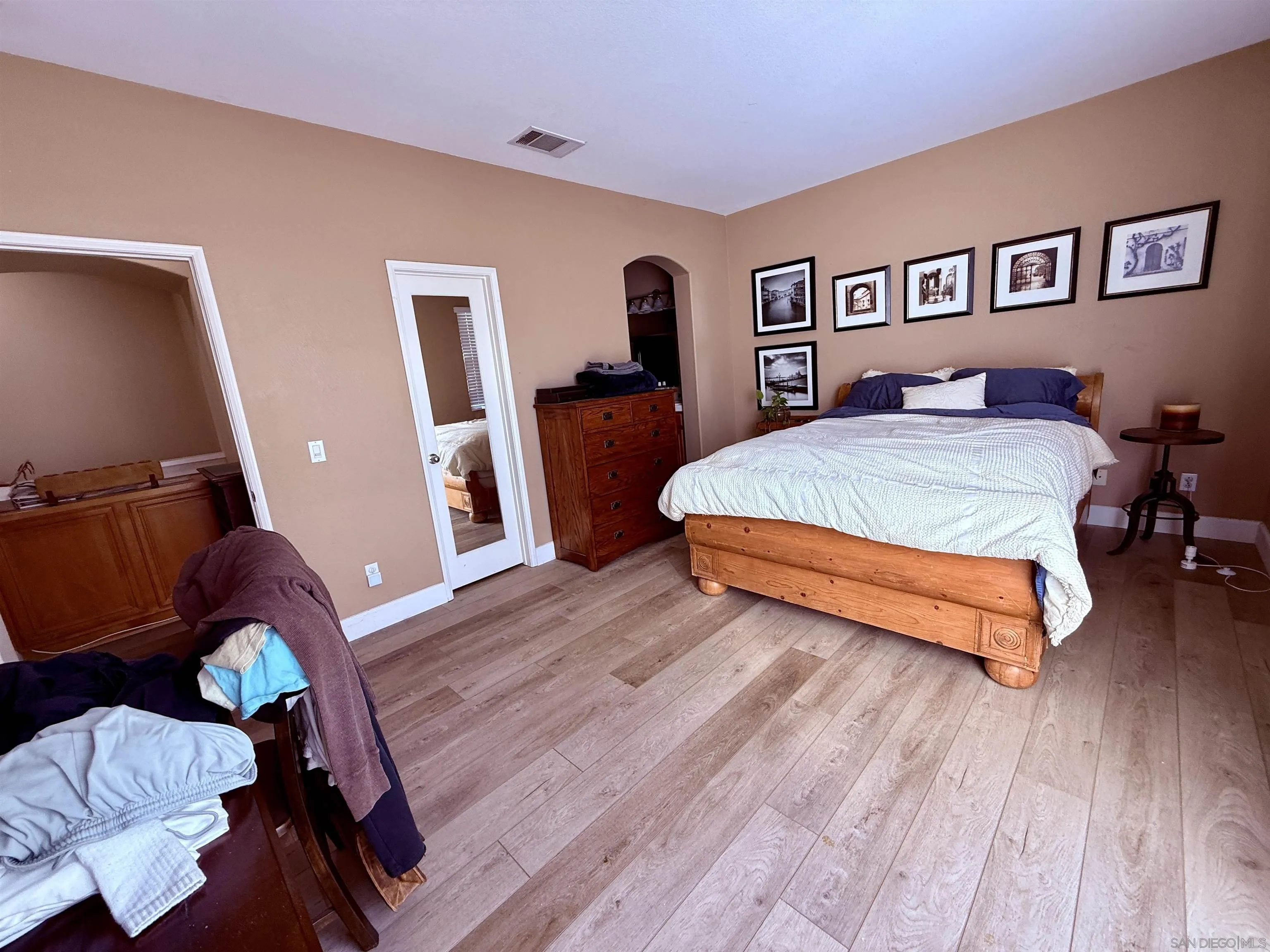6471 Terraza Portico Carlsbad, CA 92009 - Photo 9 of 19 a spacious bedroom with a bed and a desk