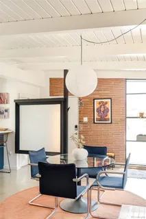 a work room with furniture and window