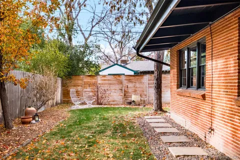 a backyard of a house with lots of green space
