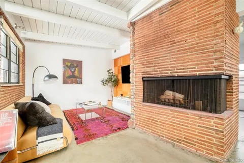 a bed room with a bed and chair