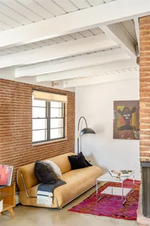 a bedroom with furniture and a window