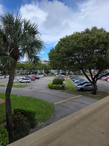 a view of street with parked cars