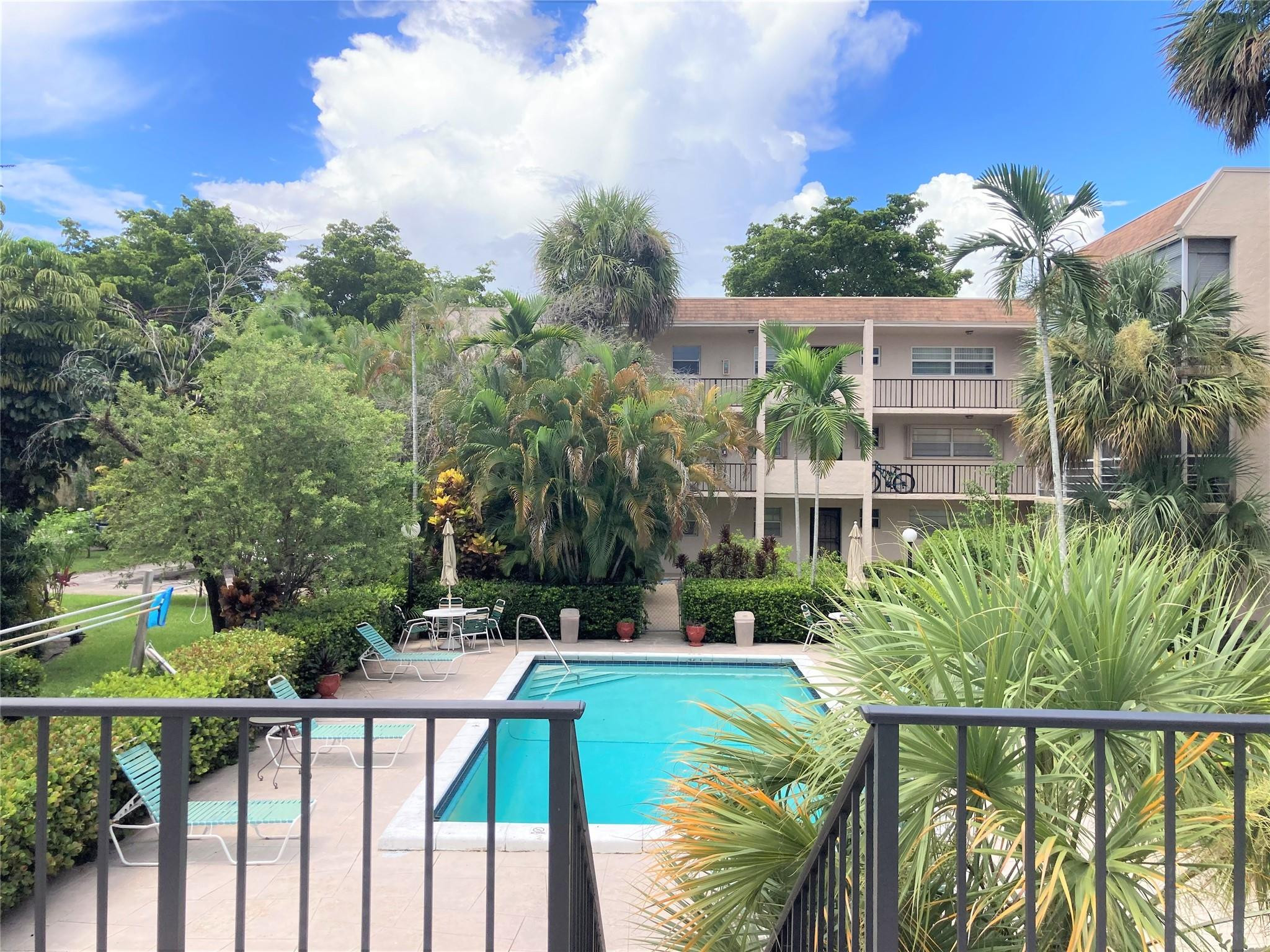 469 North Pine Island Road, Unit 308B Plantation, FL 33324 - Photo 11 of 16 a view of a house with pool and wooden floor
