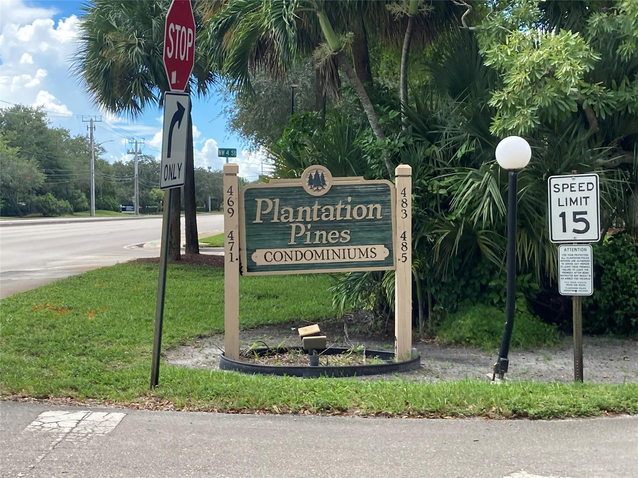469 North Pine Island Road, Unit 308B Plantation, FL 33324 - Photo 3 of 16 a sign that is sitting on the side of the road