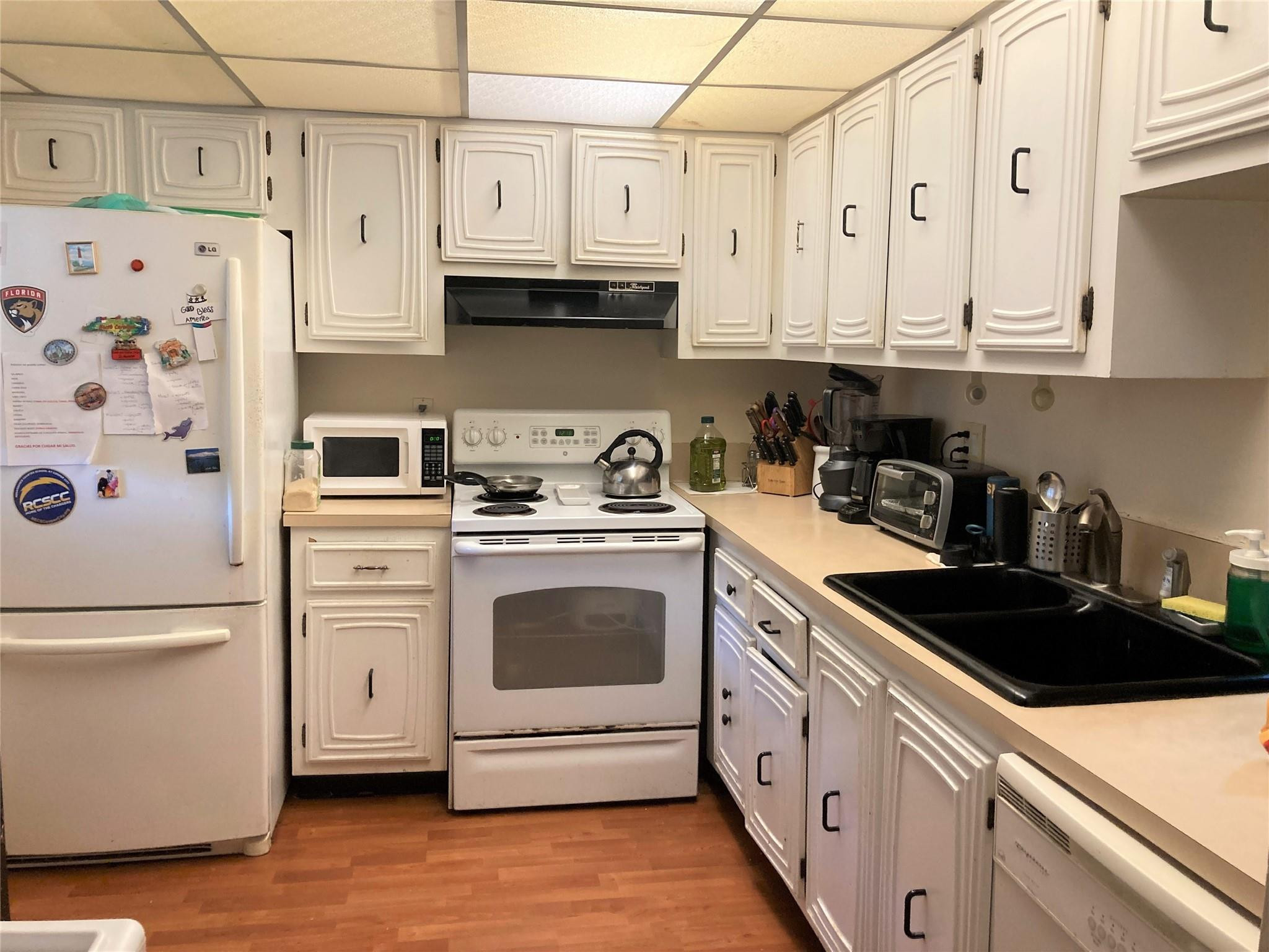 469 North Pine Island Road, Unit 308B Plantation, FL 33324 - Photo 5 of 16 a kitchen with stainless steel appliances granite countertop white cabinets sink and dishwasher