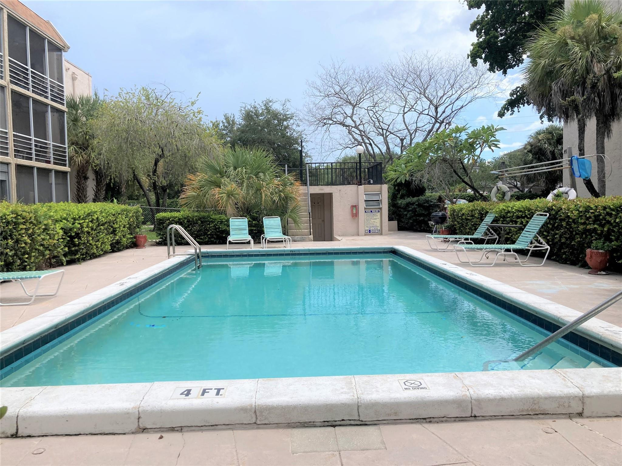 469 North Pine Island Road, Unit 308B Plantation, FL 33324 - Photo 10 of 16 a view of a swimming pool with a patio