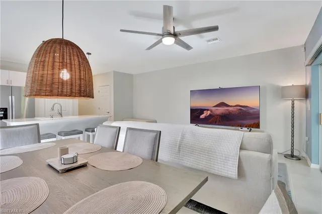 a kitchen with a stove a sink and a refrigerator