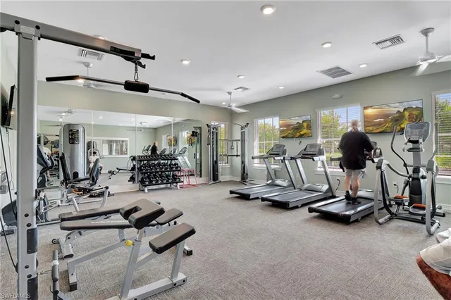 a large kitchen with kitchen island a table and chairs