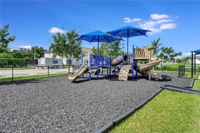 a view of swimming pool with outdoor seating and plants